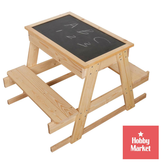 Mesa de picnic infantil de madera natural con dos bancas y cubierta reversible tipo pizarrón para dibujar.