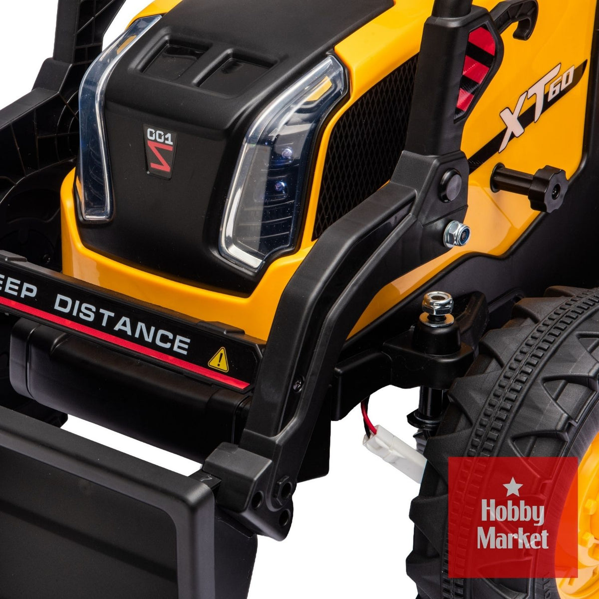 Tractor eléctrico infantil amarillo de 12V con pala frontal, detalles en negro y diseño robusto para niños.